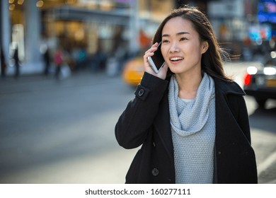 Asian Woman In New York City Times Square Calling Talking On Phone Callephohe