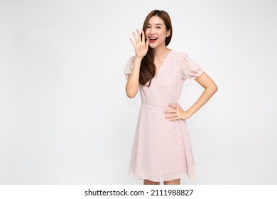 Asian woman with open mouths raising hands screaming announcement isolated on white background - Powered by Shutterstock