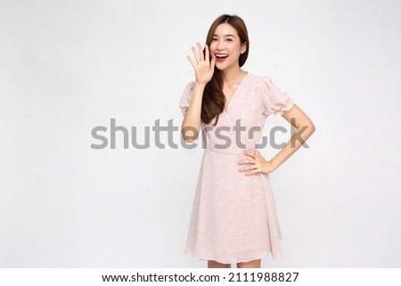 Asian woman with open mouths raising hands screaming announcement isolated on white background