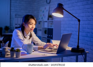 Asian Woman Overtime Work Alone In The Office