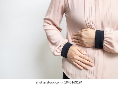 Asian Woman Patient With Abdominal Pain On Right Side Belly,painful In Abdomen,irritable Bowel Disease,lady Girl Holds Under The Ribs,stomach Ache,cirrhosis Of The Liver Disease,liver Cancer Concept