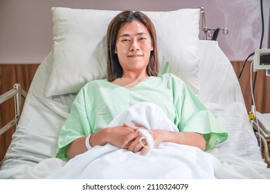 Asian Woman Patient Lay On The Hospital Bed