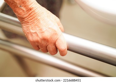 Asian Woman Patient Use Toilet Support Rail In Bathroom, Handrail Safety Grab Bar, Security In Nursing Hospital.