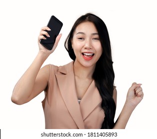 Asian woman play mobile game on smartphone and win, business outfit, white background
