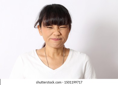 The Asian woman portrait on the white background.