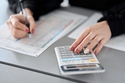 Asian Woman Preparing Tax Return Documents