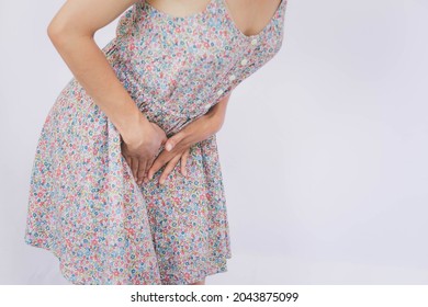 Asian woman presses the crotch on the painful area. Gynecology, period, female healthcare, digestive system, Urinary Tract Infections