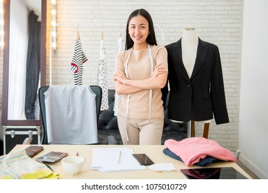 Asian Woman Professional  Fashion Designer Working In Modern Office