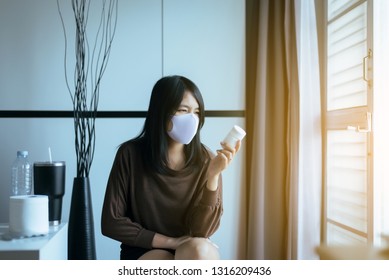 Asian Woman Reading Medicine Label And Prescription Medications,Health Care And People Concept