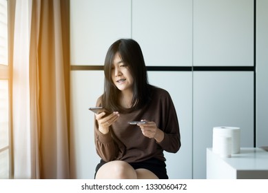 Asian Woman Reading Medicine Label And Prescription Medications,Health Care And People Concept