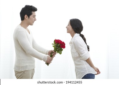  Asian Woman Receiving Flowers