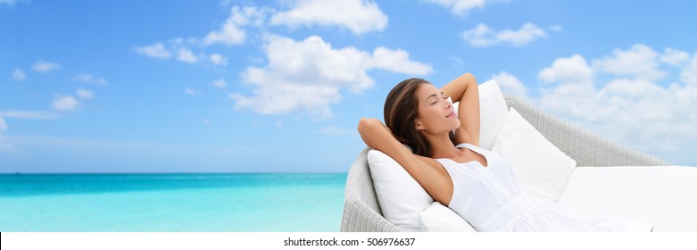 Asian Woman Relaxing Lounging On White Outdoor Beach Sofa Daybed Lounger On Ocean Background Luxury Vacation. Sleeping Girl Lying Down Comfortable Enjoying The Sun Carefree Happy. Home Living.