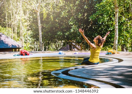 Asian woman relaxing in the Pool hot springs, Hot Springs In National Park And Natural Mineral Water.