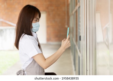 Asian Woman Restaurant Worker Scanning Code For Checking In Her Workplace, Contact Tracing Concept