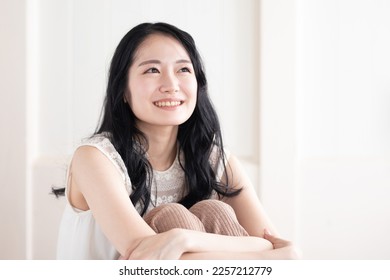 Asian woman in the room - Powered by Shutterstock