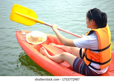 Asian Woman   Row Crew At The Lake At Kanchanaburi Province, Thailand