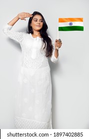 Asian Woman Saluting Wear White Kurta, Holding Indian Tricolor Flag, Celebrating Republic Day, Independence Day, India