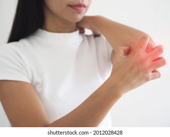 Asian Woman Scratching Her Arm And Red Elbow From Allergy. Dry Skin, Dermatitis, Insect Bites, Irritation, Rash Concept. Closeup Photo, Blurred. 