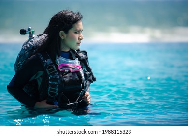 Asian Woman In Scuba Diving Gear.