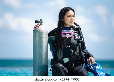 Asian Woman In Scuba Diving Gear.