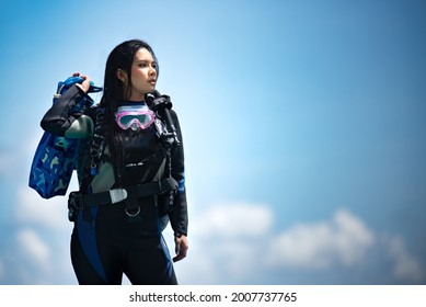 Asian Woman In Scuba Diving Gear.