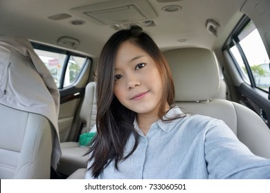 Asian woman selfie in car