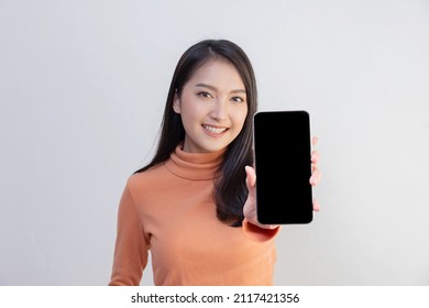 Asian Woman Show Mobile Phone Screen with Blank Copy Space