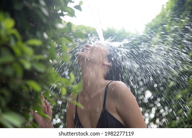 Asian Woman Shower Outdoor In Summer Background