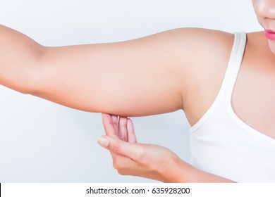 asian woman showing her fat upper arm