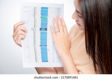 asian woman shows many ovulation test. The concept of female fertility and high luteinizing hormone. The right time to conceive a child. infertility Concept. - Shutterstock ID 2170891481