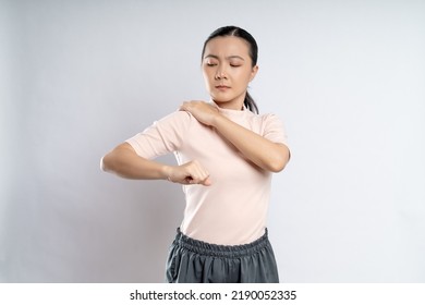 Asian Woman Was Sick With Body Pain Touching Her Body And Standing Isolated On White Background.