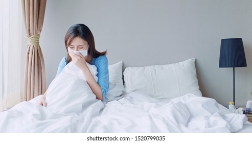 Asian Woman Sick And Cough In The Bedroom