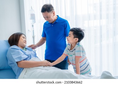 Asian Woman, Sick, Stay In Hospital. Lying On The Patient's Bed Beside The Window A Son And Family Came To Visit And Encourage