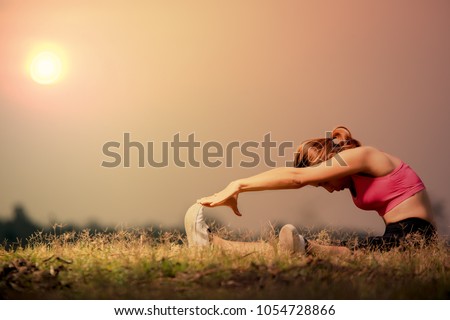 Similar – Two sisters doing gymnastics at sunset