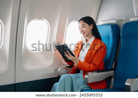 Asian woman sitting in a seat in airplane and looking out the window going on a trip vacation travel concept.Capture the allure of wanderlust with this stunning image
