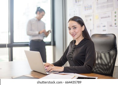 Asian Woman Sitting And Working At Office Place, Woman Working Concept, 20-30 Year Old.