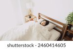 Asian woman sleeping in bed