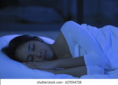 Asian Woman Are Sleeping At Night.