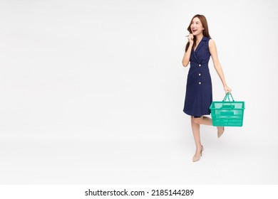 Asian Woman Smiling And Holding Grocery Basket Isolated On White Background, Shopping And Supermarket Concept, Full Body Composition