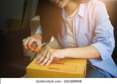 Asian Woman Smiling With Unboxing At Home. Online Shoping Concept.