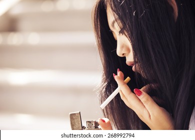 Asian Woman Smoking