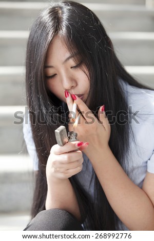 https://image.shutterstock.com/image-photo/asian-woman-smoking-450w-268992776.jpg