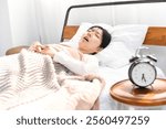 Asian woman snoring and sleeping on the bed