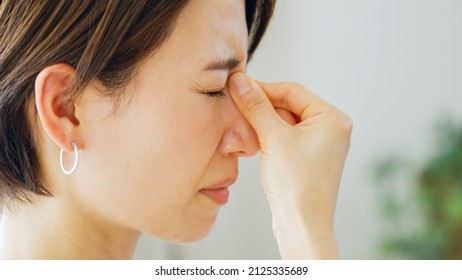 Asian Woman With Sore Eyes