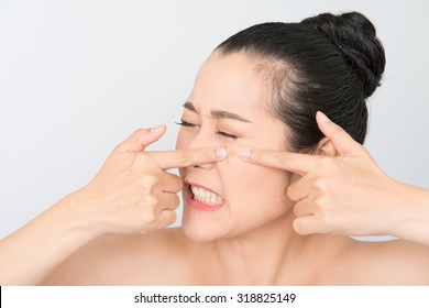 Asian Woman Squeezing Pimples