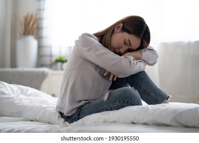 Asian woman with stress, She kept herself alone in her bedroom, Depression.