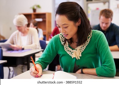 Asian Woman Studying At An Adult Education Class