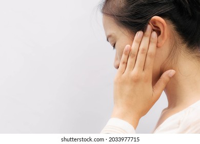 Asian Woman Suffering From Earache. Symptoms Of Acute External Otitis Media. Health Care Concept.