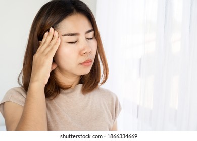 Asian Woman Suffering From Headache, Nausea ,dizzy After Wakeup In Morning 