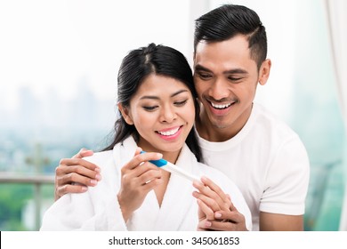 Asian Woman Surprising Her Husband With Positive Pregnancy Test, He Seems Reasonably Pleased
